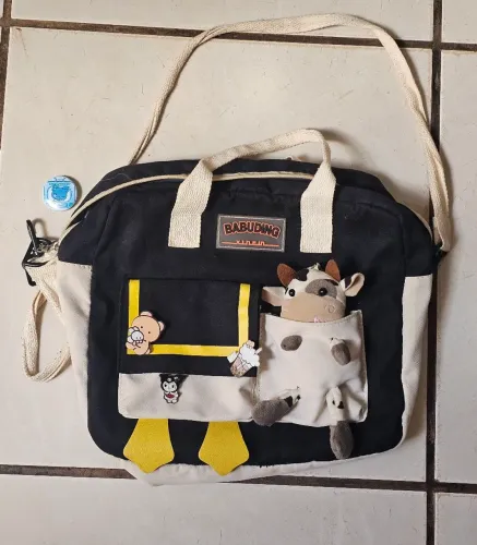 Bolsa carteiro babuding preta e bege