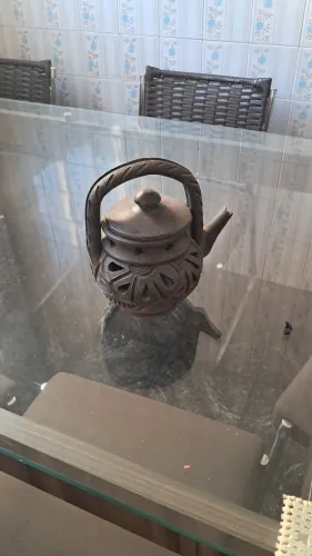 Chaleira em ceramica queimada