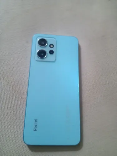 Vendo celular Redmi note 12, não tem trincado, apenas marcas de uso. * 