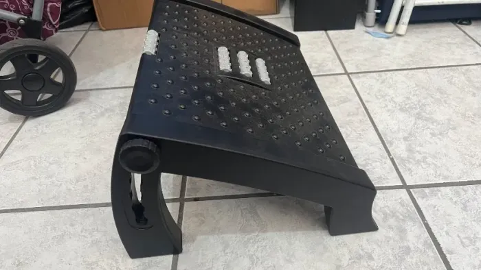Descanso para pés com massageador