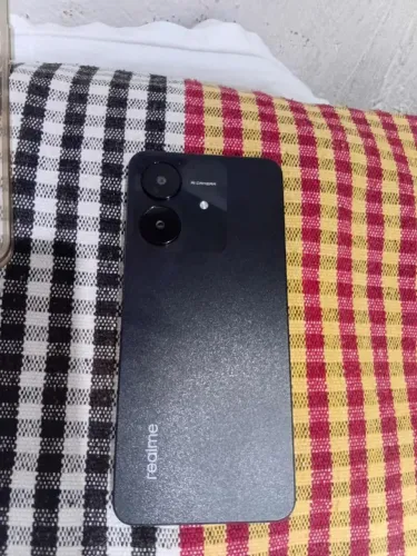 Celular redmi 60 e uma caixa de som tudo novo