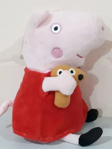 Boneca Peppa Pig com 30cm de pelúcia de pendurar. Ela toca uma canção  
