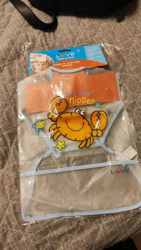 Babador com manga e bolso para introdução alimentar