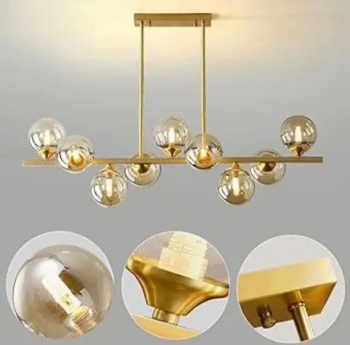 lustre pendente linear de estilo jabuticaba com estrutura dourada e globos de vidro âmbar