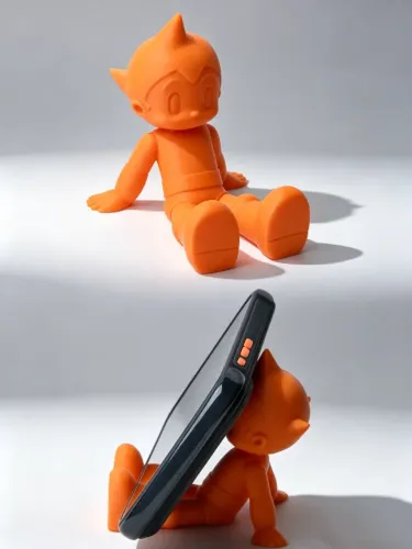 Porta Celular Laranja Boneco AstroBoy Suporte para Celular de Mesa Astro Boy