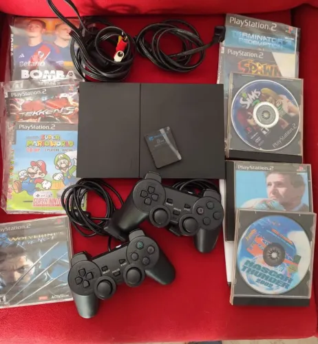 Playstation 2 Slim completo com 2 controles e vários Jogos Leitor funcionando. Ac cartão
