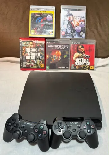 PlayStation 3 Slim + 2 Controles + 5 Jogos