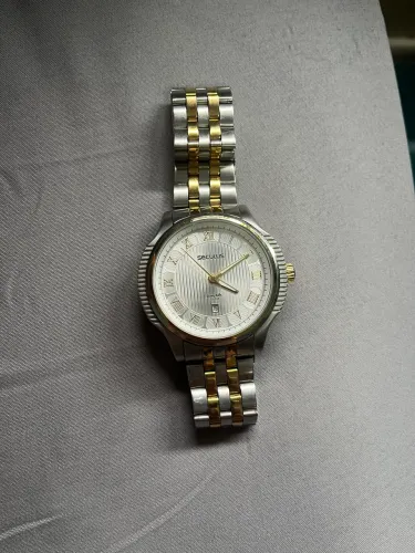 Relógio Seculus prateado e dourado 