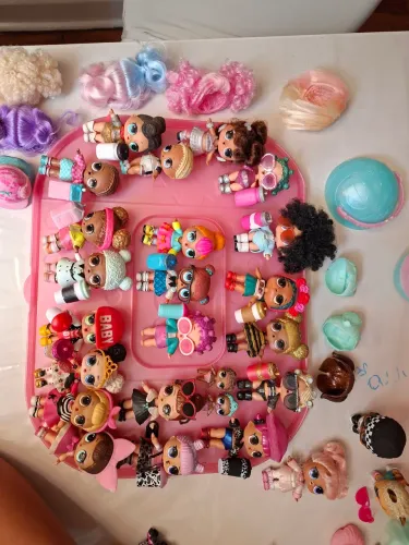 Boneca Olx lote 27 bonecas com mala.