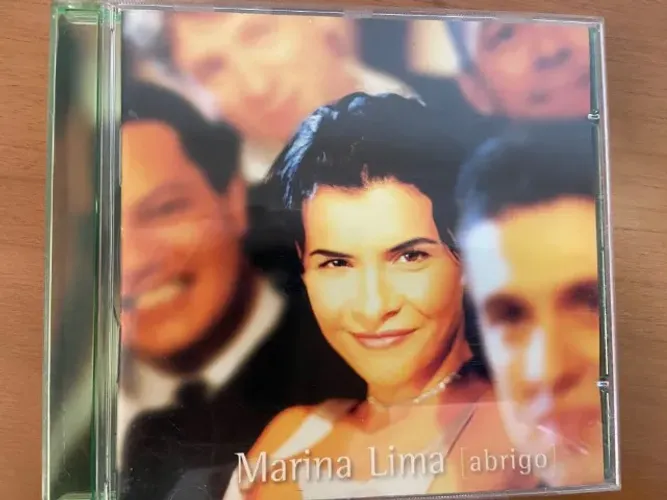 CD Marina Lima - Abrigo (1995) com o sucesso Nem Luxo, Nem Lixo