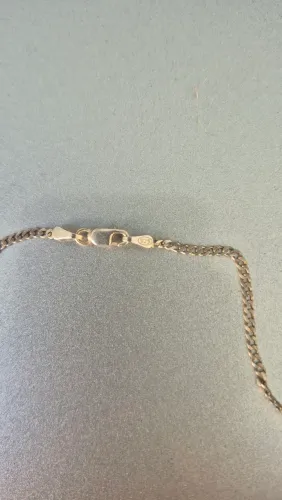 CORRENTE DE PRATA E A PULSEIRA PRESCISA ARRUMAR O FECHO