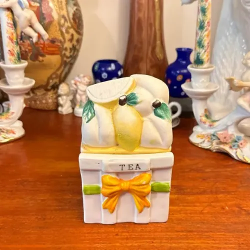 Antigo porta-chá em porcelana