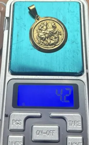 Pingente em ouro de São Jorge 2.600,00
