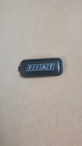 Uno tempra tipo Elba  emblema central do volante.