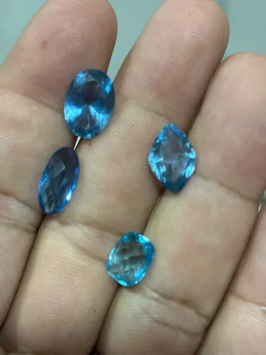 04 pedras lapidadas tenho elas como topázio azul
