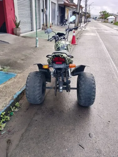 Triciclo com plotagem camuflado 6.000