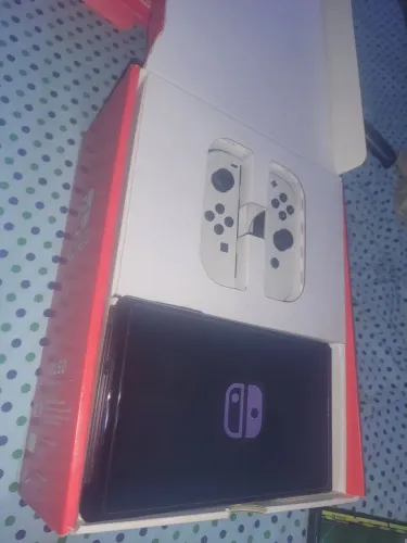 Nintendo switch oled d.e.sb.l.o.q.u.e.a.d.o cartão 128 gigas.