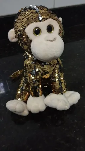 Macaco de pelúcia com paetês