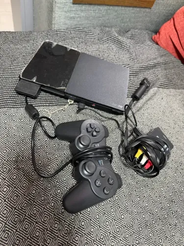 PlayStation 2 com leitor de disco funcionando
