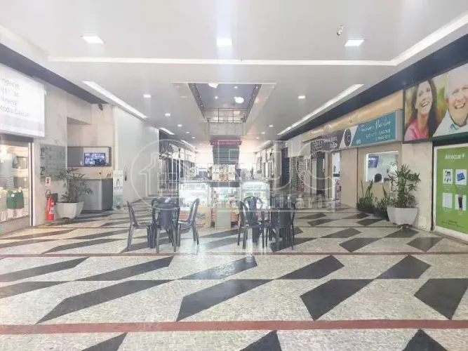 Loja em centro comercial (galeria ) com mezanino e 1 vaga de garagem escriturada