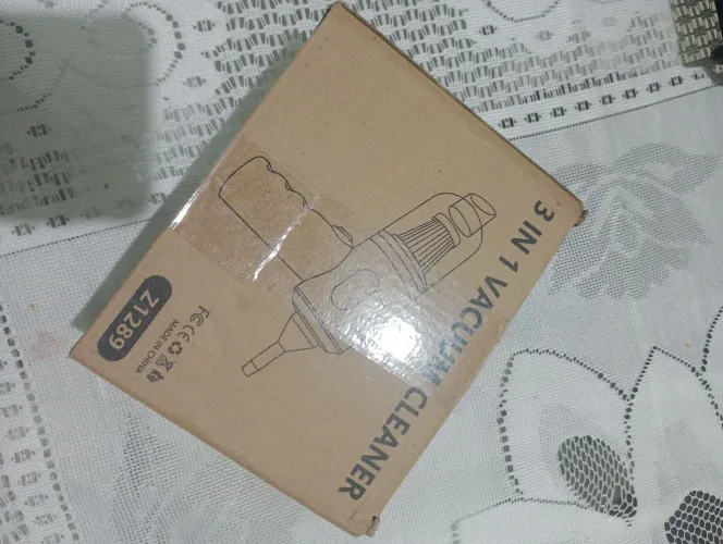 Mini aspirador de pó.