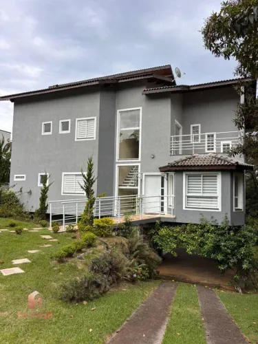 Casa com 4 dormitórios à venda, 408 m² por R$ 1.550.000,00 - Condomínio Reserva Ibirapitan