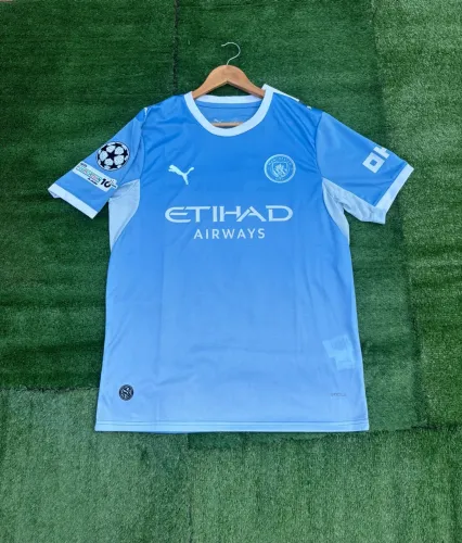 CAMISA MANCHESTER CITY 2026/27 COM PATCH DA CHAMPIONS 2026