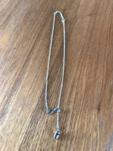 Colar Infinito com Pingente de Dente Novo