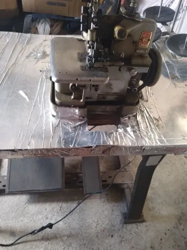 Máquina de custura Enverloki