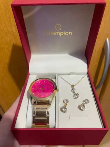 Relógio feminino Champion dourado com fundo rosa 