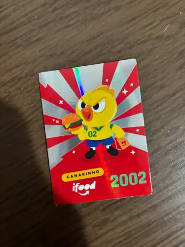 Figurinha ifood 2002 canarinho