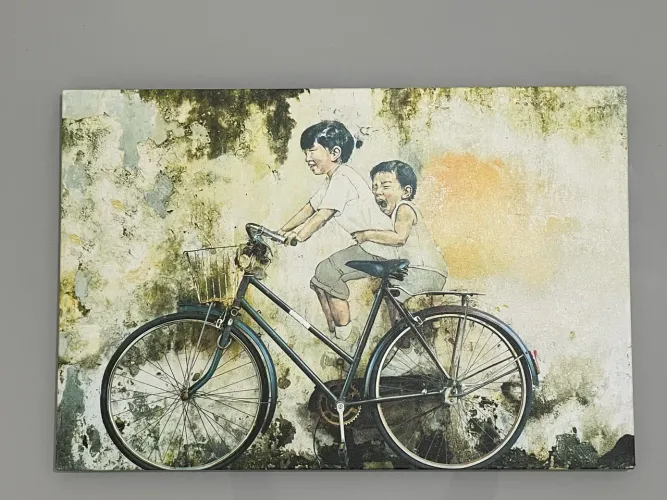 Quadro decorativo crianças na bicicleta