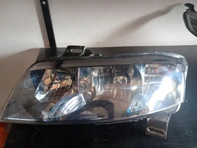 Farol Stilo lado motorista original