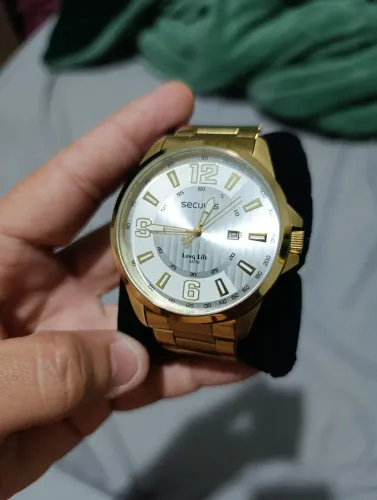 Relógio Seculus masculino dourado na caixa 