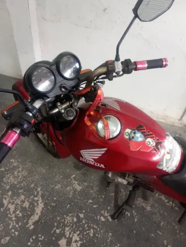 Cg tinta kse. Motor feito, parte elétrica nova, bateria zerada. Liga a partida e pedal.