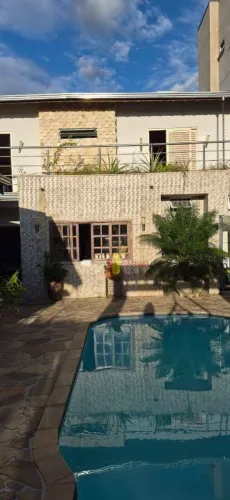 Casa com 4 dormitórios para alugar por R$ 8.170,69/mês - Jardim São João - Jaguariúna/SP