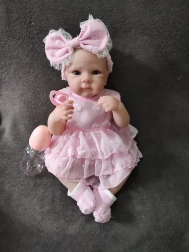 Bebê Reborn 100%silicone+roupa complata+chupeta magnetica+certidão de nascimento+mamadeira