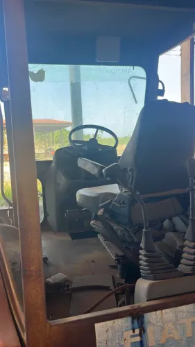 Retroescavadeira, ano 2002