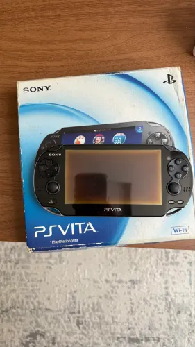 PSVita com caixa e acessórios