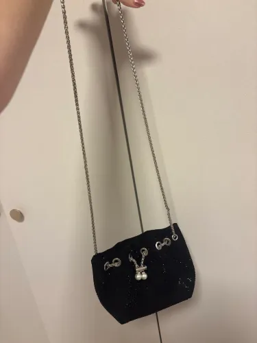 bolsa preta com o mini brilhos