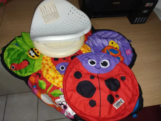 Lamaze Girar e Explorar Tapete de Atividades Giratório para Bebês.