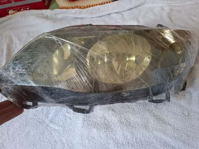 Farol de Gol G5 Máscara Negra Esquerdo (motorista)