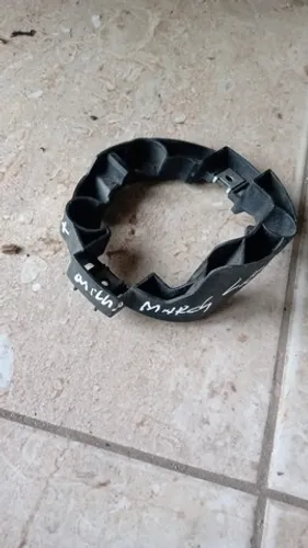 Suporte Farol de Milha Nissan March lado esquerdo