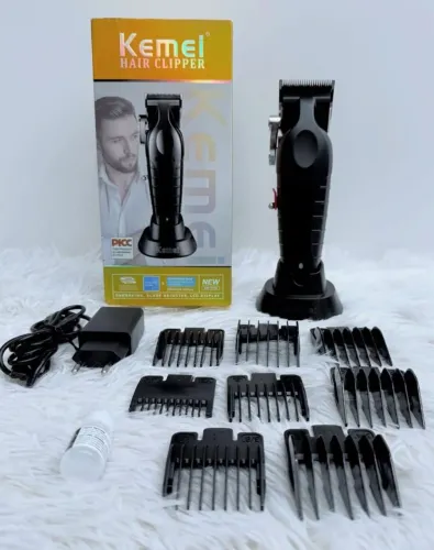 Máquina de Cortar Cabelo Kemei Profissional _nova na caixa, com vários pentes!!!