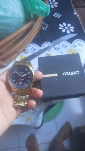 Relógio orient dourado