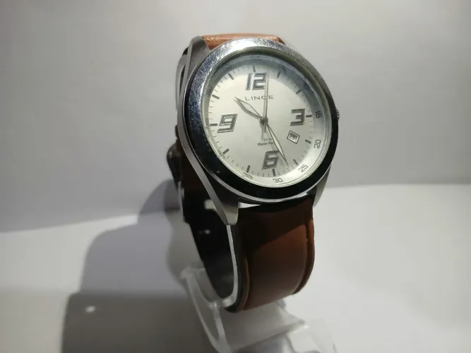 Relógio Lince prata com pulseira de couro