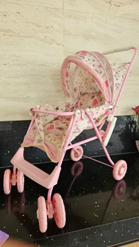 Carrinho para boneca reclinável.