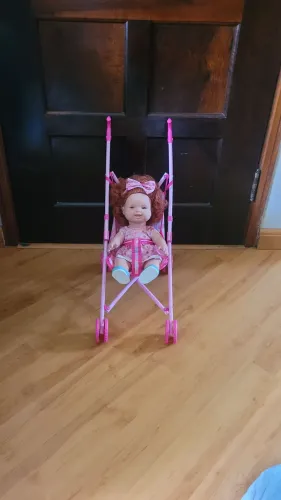 Vendo boneca ruiva com carrinho