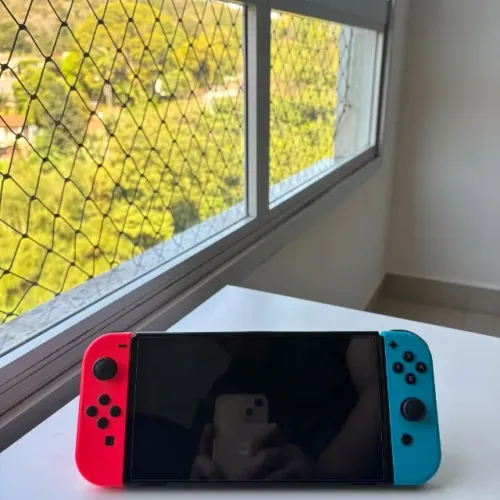 Nintendo Switch OLED IMPECÁVEL - dock + joy-cons seminovos + carregador + case licenciada