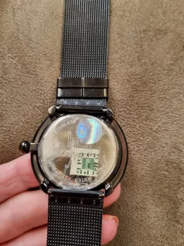relógio dumond retro, original, novo, borboletas no fundo e pulseira de metal